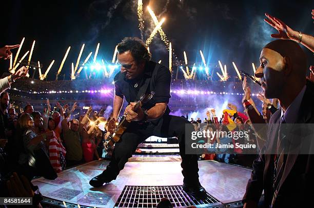 Musician Bruce Springsteen and the E Street Band perform at the Bridgestone halftime show during Super Bowl XLIII between the Arizona Cardinals and...