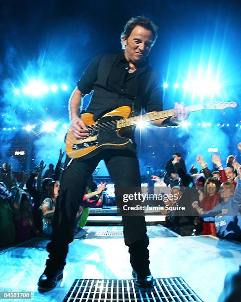 Musician Bruce Springsteen and the E Street Band perform at the Bridgestone halftime show during Super Bowl XLIII between the Arizona Cardinals and...