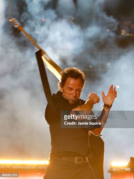 Musician Bruce Springsteen and the E Street Band perform at the Bridgestone halftime show during Super Bowl XLIII between the Arizona Cardinals and...