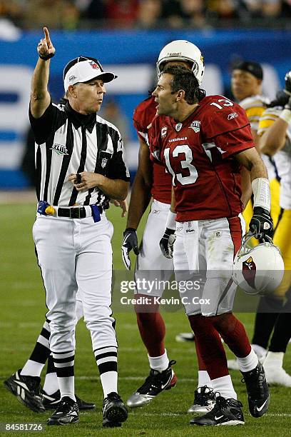 Quarterback Kurt Warner of the Arizona Cardinals argues with referee Terry McAulay as he signals that the Pittsburgh Steelers have possession of the...