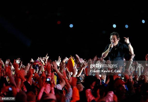 Musician Bruce Springsteen and the E Street Band perform at the Bridgestone halftime show during Super Bowl XLIII between the Arizona Cardinals and...