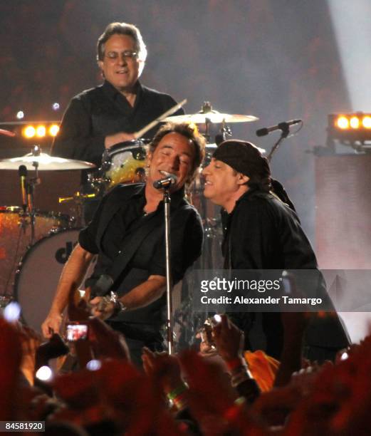 Drummer Max Weinberg, Musician Bruce Springsteen and Guitarist Steven Van Zandt of the E Street Band perform at the Bridgestone halftime show during...