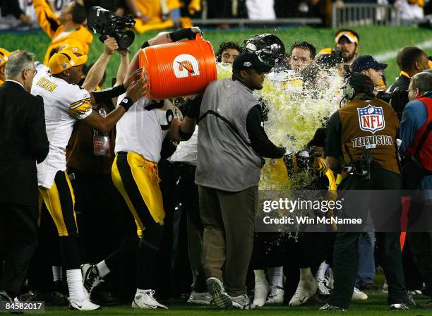 Head coach Mike Tomlin of the Pittsburgh Steelers gets gatorade dumped on him by his teammates after defeating the Arizona Cardinals to win Super...