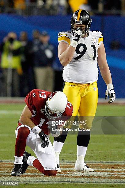 Arizona Cardinals quarterback Kurt Warner argues with a referee as Arizona  Cardinals wide receiver Larry Fitzgerald looks on in the third quarter  against the Pittsburgh Steelers at Super Bowl XLIII at Raymond
