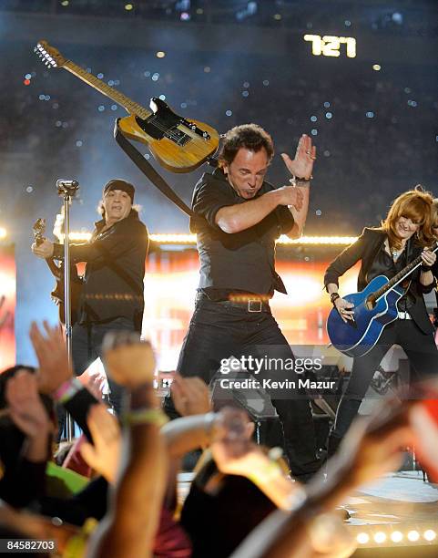 Musician Bruce Springsteen and the E Street Band perform at the Bridgestone halftime show during Super Bowl XLIII between the Arizona Cardinals and...