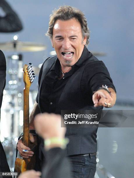 Musician Bruce Springsteen and the E Street Band perform at the Bridgestone halftime show during Super Bowl XLIII between the Arizona Cardinals and...