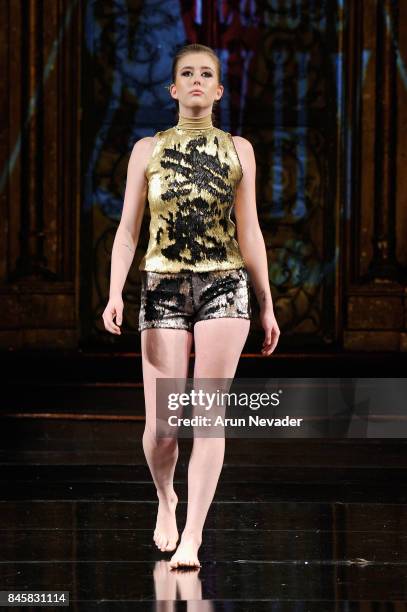 Model walks the runway for the 21 Reasons Why by Madeline Stuart fashion show during New York Fashion Week NYFW Art Hearts Fashion at The Angel...