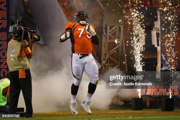 Offensive tackle Menelik Watson of the Denver Broncos is introduced to the game against the Los Angeles Chargers at Sports Authority Field at Mile...