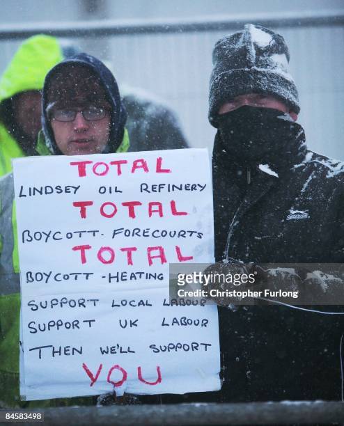 Strikers at the Lindsey oil refinery in North Lincolnshire display a placard during protests on February 2, 2009 in Immingham, England. Several...