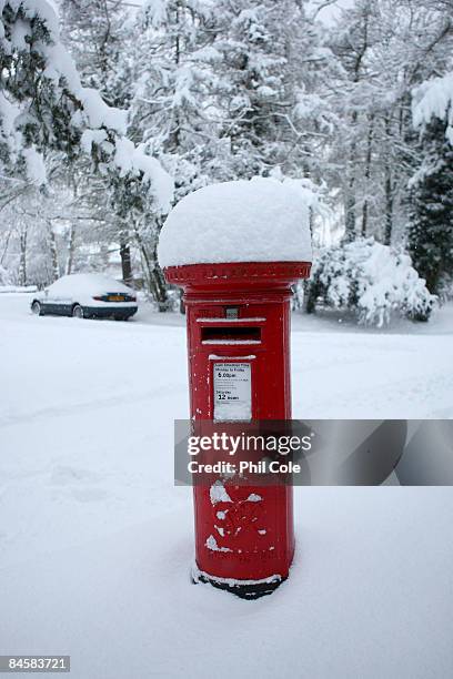 Pillar box stands covered in snow on February 2, 2009 in Carshalton, England. The United Kingdom has suffered its heaviest snowfall since the 1990's....