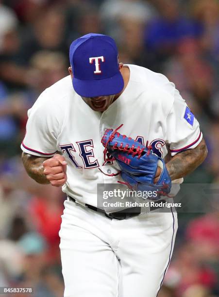 Matt Bush of the Texas Rangers reacts after striking out Mitch Haniger of the Seattle Mariners in the seventh inning at Globe Life Park in Arlington...