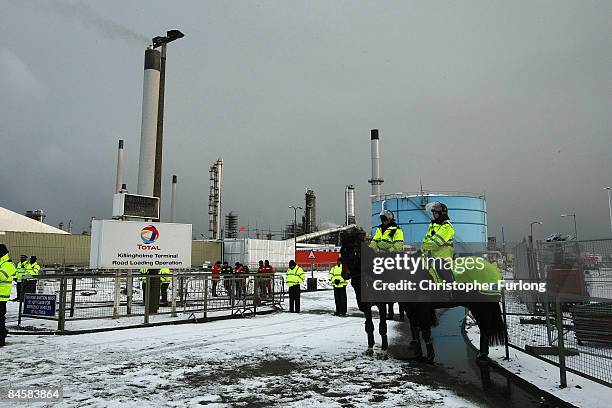 Police officers guarding the Lindsey oil refinery in North Lincolnshire brave a blizzard on February 2, 2009 in Immingham, England. Several hundred...