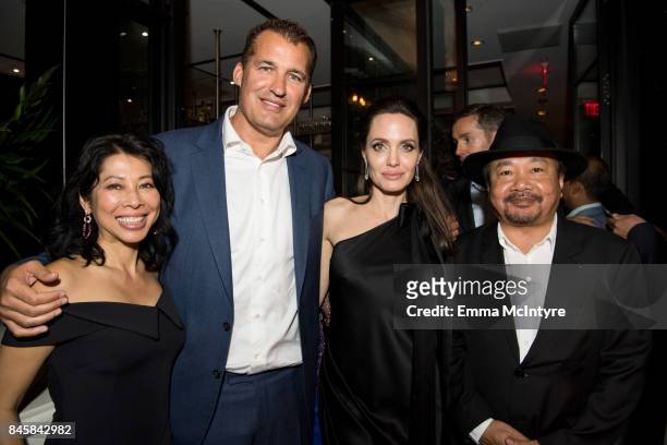 Loung Ung, Netflix's Scott Stuber, Angelina Jolie and Rithy Panh attend the World Premiere of Netflix's Film's "First They Killed My Father" during...