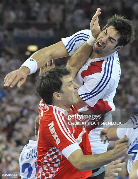 France's Nikola Karabatic vies with Croatia's Petar Metlicic during their men's World Championships final match on at the "Arena Zagreb" sports hall...