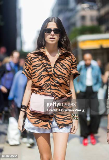 Leandra Medine wearing tiger print seen in the streets of Manhattan outside Derek Lam during New York Fashion Week on September 11, 2017 in New York...