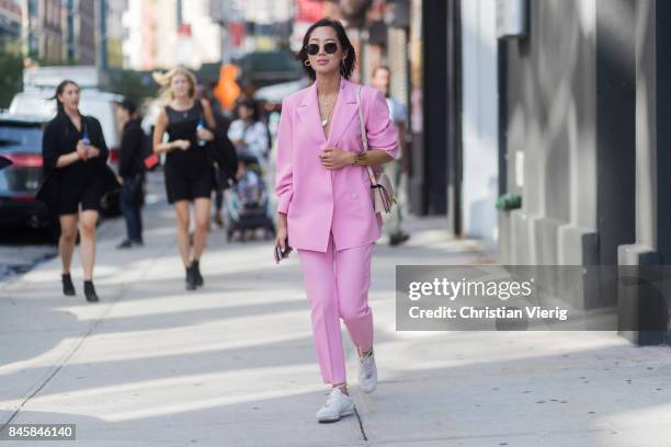 Aimee Song wearing a pink suit seen in the streets of Manhattan outside Phillip Lim during New York Fashion Week on September 11, 2017 in New York...