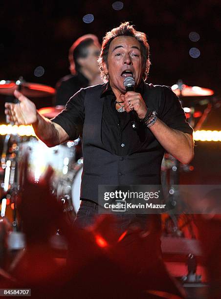 Musician Bruce Springsteen and the E Street Band perform at the Bridgestone halftime show during Super Bowl XLIII between the Arizona Cardinals and...