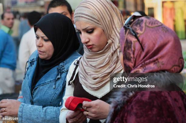 Fashionable women shop for cloth in the garment district of the fashionable Karradah neighborhood February 2, 2009 in central Baghdad, Iraq....