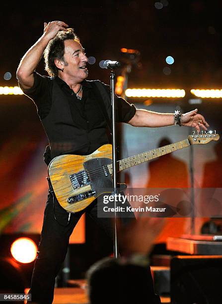 Musician Bruce Springsteen and the E Street Band perform at the Bridgestone halftime show during Super Bowl XLIII between the Arizona Cardinals and...