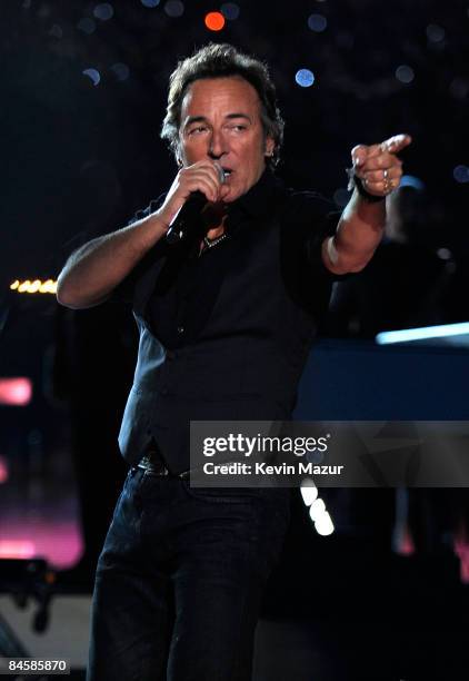 Musician Bruce Springsteen and the E Street Band perform at the Bridgestone halftime show during Super Bowl XLIII between the Arizona Cardinals and...