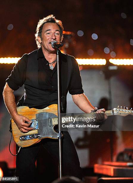 Musician Bruce Springsteen and the E Street Band perform at the Bridgestone halftime show during Super Bowl XLIII between the Arizona Cardinals and...