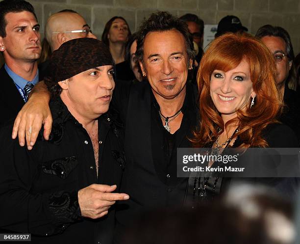 Musicians Steven Van Zandt, Bruce Springsteen and Patti Scialfa of the E Street Band perform at the Bridgestone halftime show during Super Bowl XLIII...