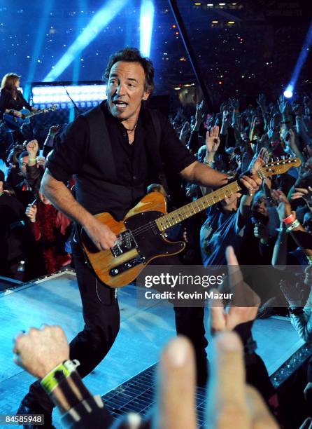 Musician Bruce Springsteen and the E Street Band perform at the Bridgestone halftime show during Super Bowl XLIII between the Arizona Cardinals and...