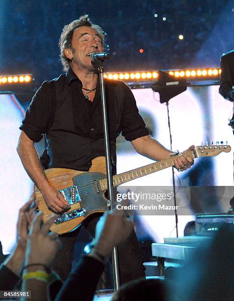 Musician Bruce Springsteen and the E Street Band perform at the Bridgestone halftime show during Super Bowl XLIII between the Arizona Cardinals and...