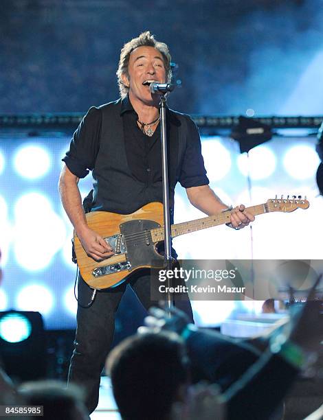 Musician Bruce Springsteen and the E Street Band perform at the Bridgestone halftime show during Super Bowl XLIII between the Arizona Cardinals and...