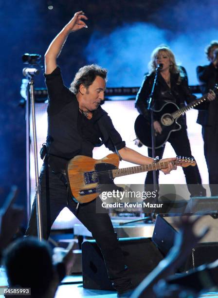 Musician Bruce Springsteen and the E Street Band perform at the Bridgestone halftime show during Super Bowl XLIII between the Arizona Cardinals and...