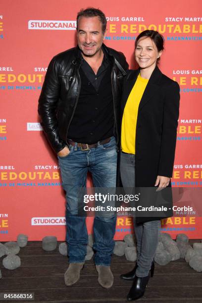 Actor Jean Dujardin and Nathalie Pechalat attend the "Le Redoutable" Paris Premiere at Cinema du Pantheon on September 11, 2017 in Paris, France.