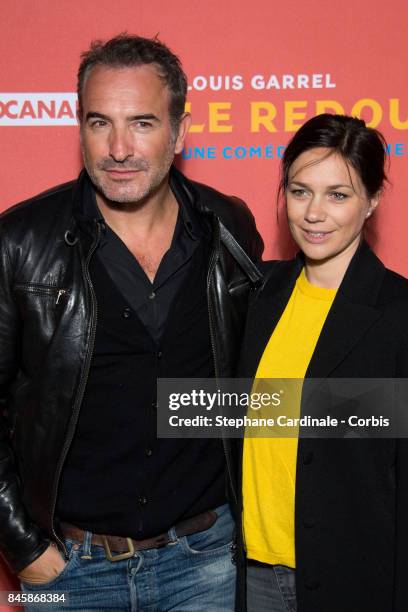 Actor Jean Dujardin and Nathalie Pechalat attend the "Le Redoutable" Paris Premiere at Cinema du Pantheon on September 11, 2017 in Paris, France.