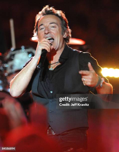 Musician Bruce Springsteen and the E Street Band perform at the Bridgestone halftime show during Super Bowl XLIII between the Arizona Cardinals and...