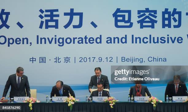 Director-General Roberto Azevedo of the World Trade Organization, President Jim Yong Kim of the World Bank, Chinese Premier Li Keqiang, Managing...