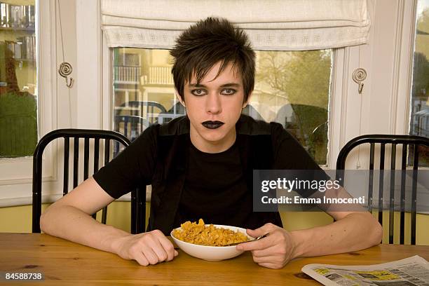 young goth man having breakfast - goth stock pictures, royalty-free photos & images