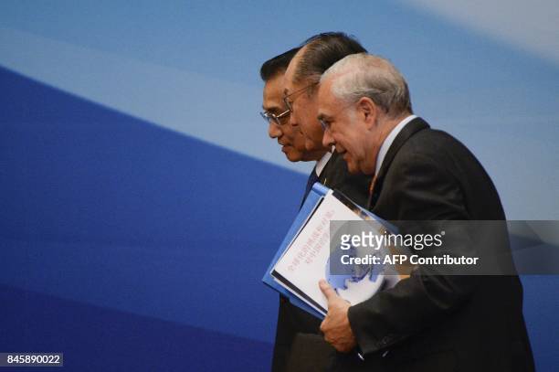President of the World Bank Jim Yong Kim , Chinese Premier Li Keqiang and secretary-general of the Organisation of Economic Co-operation and...