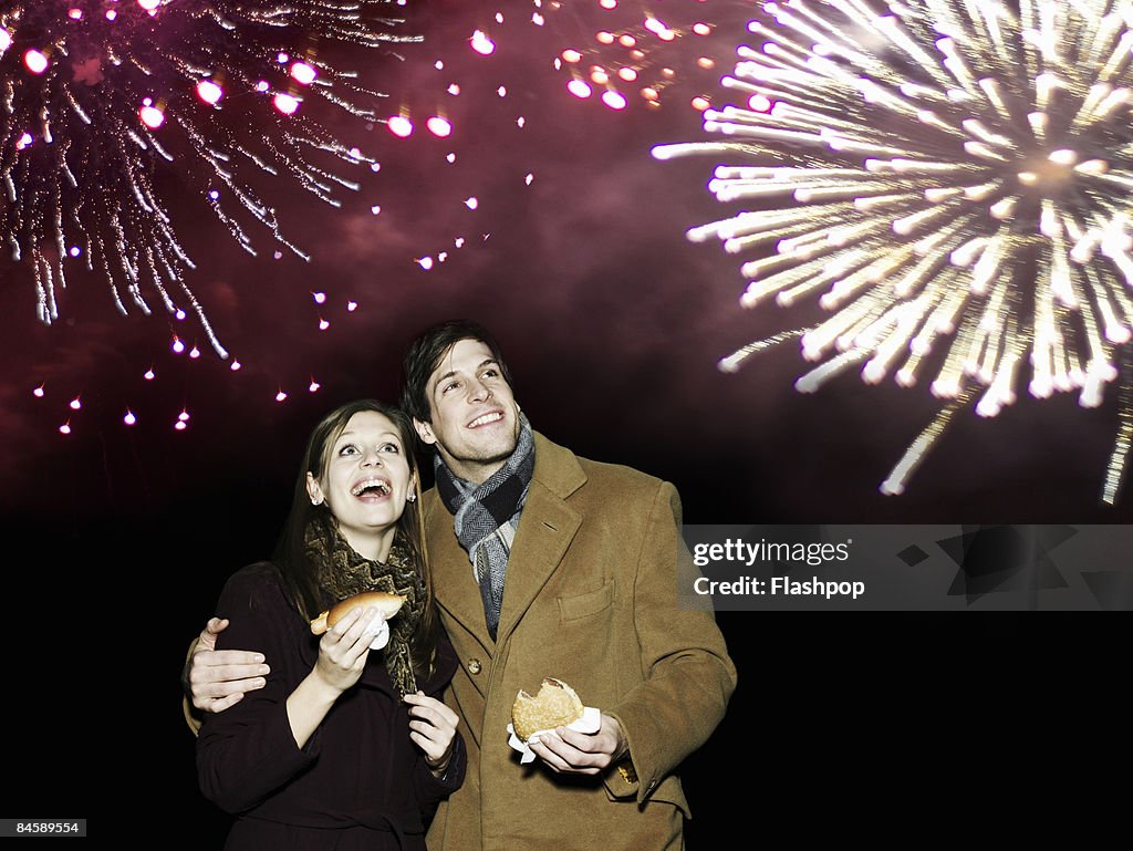 Couple enjoying firework display