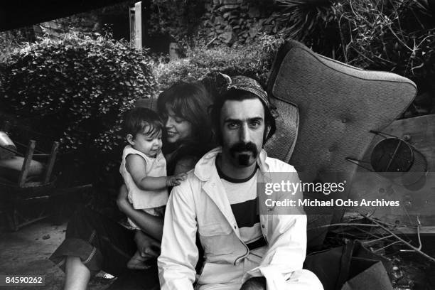 Rock and roll guitariist Frank Zappa poses for a portrait in Laurel Canyon with his wife Gail Zappa and daughter Moon Unit Zappa in February 1968 in...