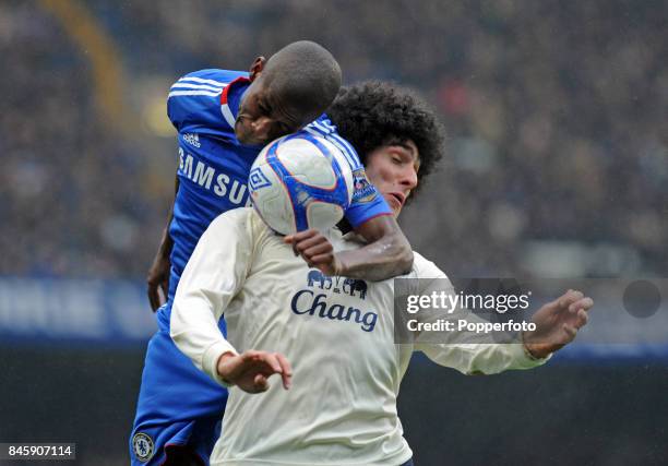 Marouane Fellaini of Everton and Ramires of Chelsea in action during the FA Cup 4th round replay match between Chelsea and Everton at Stamford Bridge...