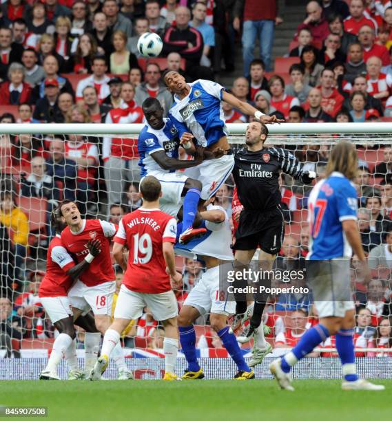 Goalkeeper Manuel Almunia of Arsenal is outjumped by Steven N'Zonzi and Christopher Samba of Blackburn during the Barclays Premiership match between...
