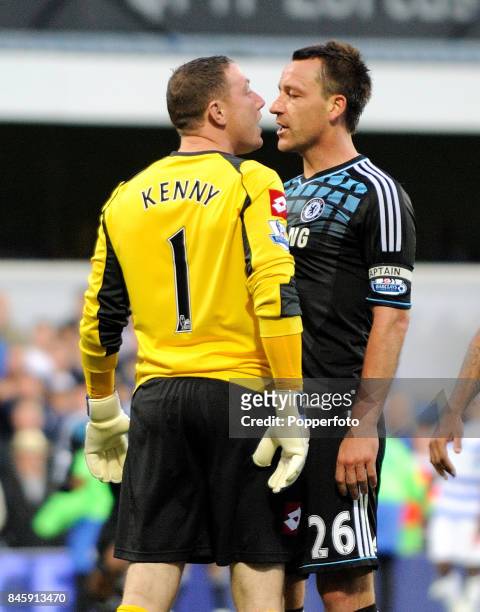 John Terry of Chelsea clashes with goalkeeper Paddy Kenny of QPR during the Barclays Premiership match between Queens Park Rangers and Chelsea at...