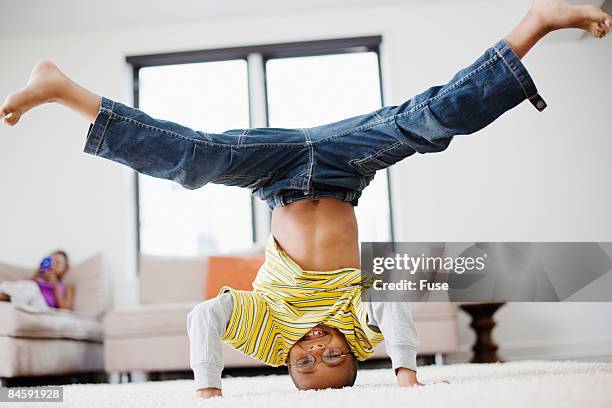 little boy doing a headstand - doing the splits stock pictures, royalty-free photos & images