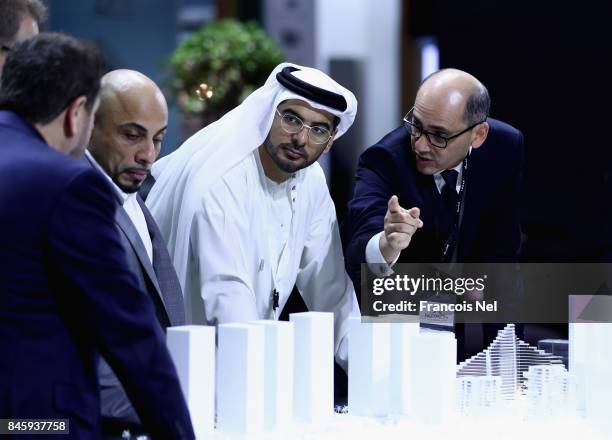 Visitors attend Cityscape Global at Dubai World Trade Centre on September 12, 2017 in Dubai, United Arab Emirates.