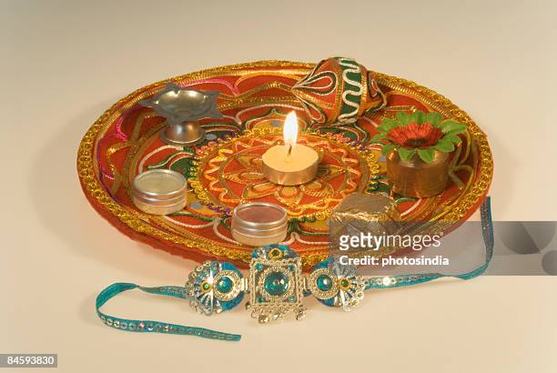 close-up of a rakhi with a rakhi thali - raksha bandhan stock pictures, royalty-free photos & images