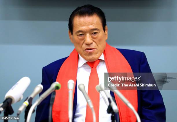 Japanese professional wrestler-turned-lawmaker Antonio Inoki, or Kanji Inoki speaks during a press conference on arrival at Haneda International...