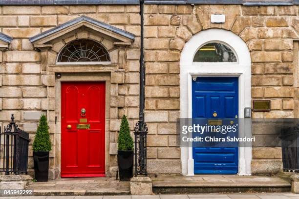 the colored doors near merrion square, dublin - blue house red door stock pictures, royalty-free photos & images