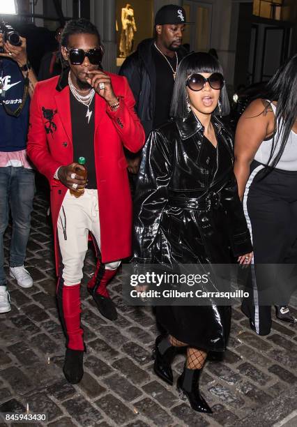 Rappers Offset and Cardi B are seen leaving the Helmut Lang Seen By Shayne Oliver fashion show during New York Fashion Week on September 11, 2017 in...