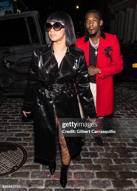 Rappers Offset and Cardi B are seen leaving the Helmut Lang Seen By Shayne Oliver fashion show during New York Fashion Week on September 11, 2017 in...