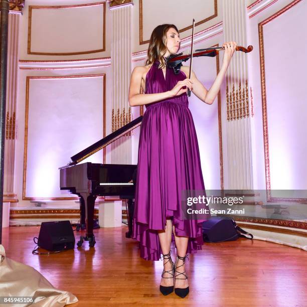 Guest performs at the Dennis Basso Spring/Summer 2018 Runway Show during New York Fashion Week at The Plaza Hotel on September 11, 2017 in New York...