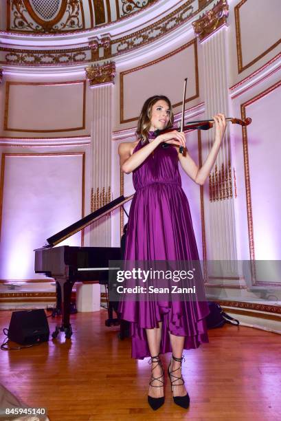 Guest performs at the Dennis Basso Spring/Summer 2018 Runway Show during New York Fashion Week at The Plaza Hotel on September 11, 2017 in New York...